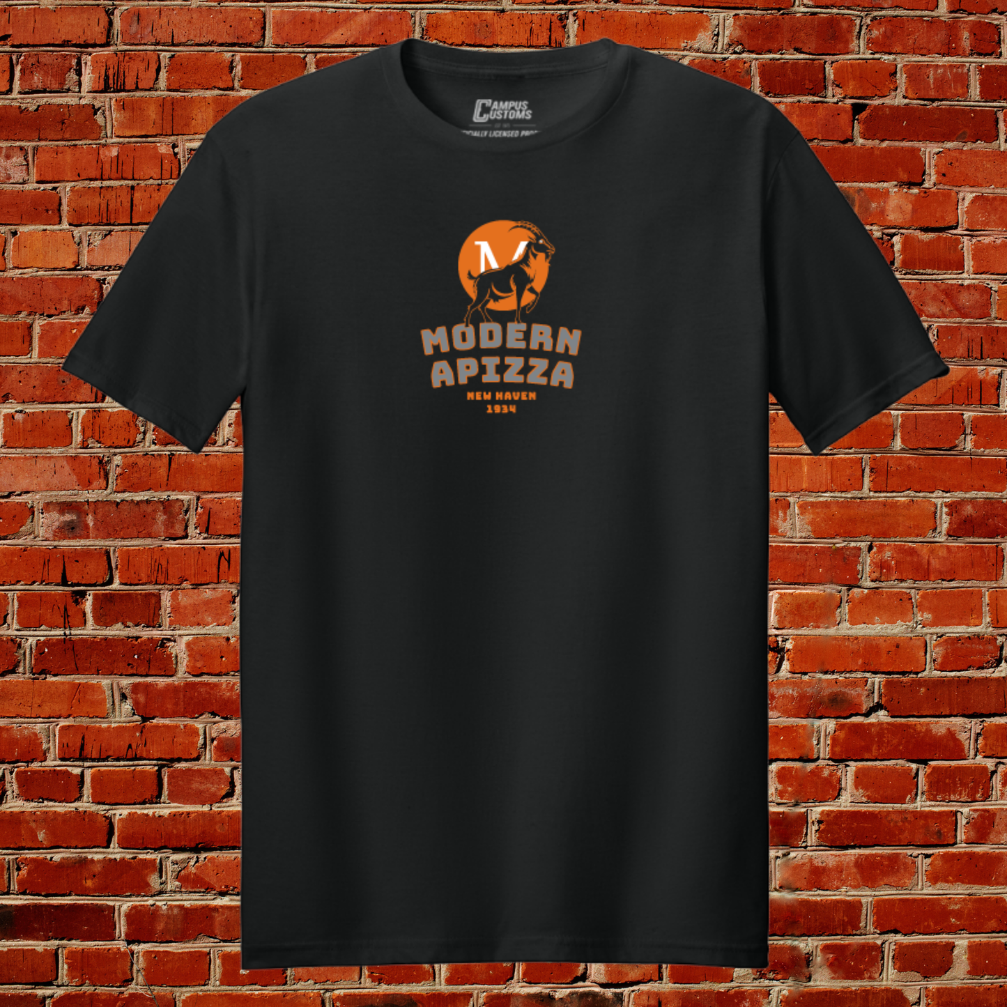 Black t-shirt with 'Modern Apizza' logo against a brick wall background